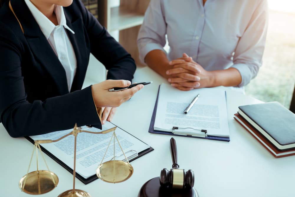 A lawyer is currently counseling the client's trial at the lawyer office.