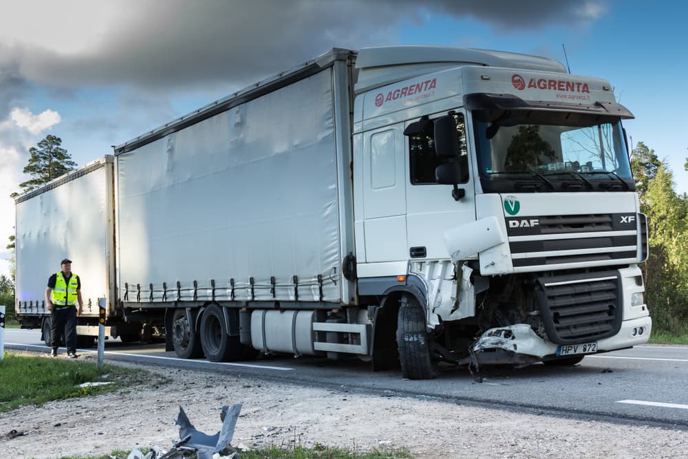 Head-on collision involving a BMW and DAF truck on Latvia's A4 road.