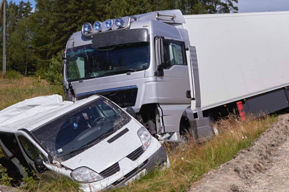 Automobile involved in a collision with a large truck, transportation accident background